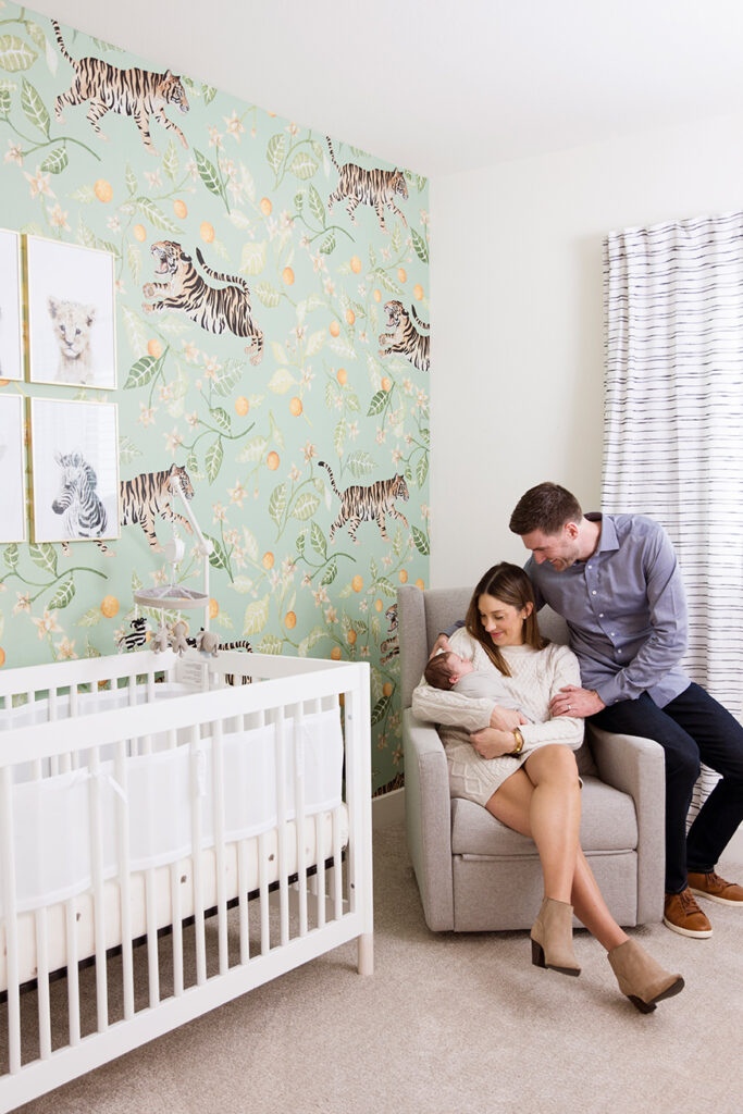 newborn photographer frisco taking family photos in your nursery