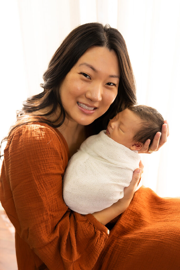 best newborn photographer dallas taking gorgeous photos of mom and baby