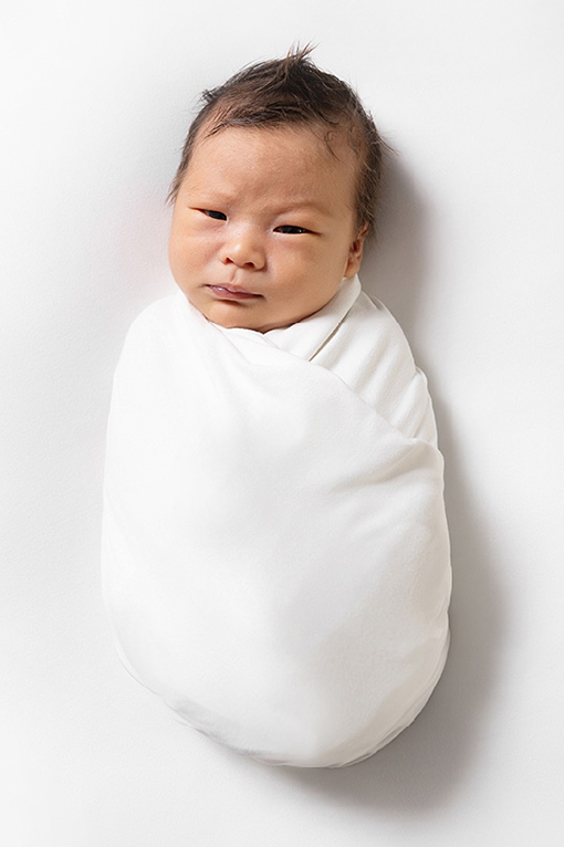 frisco in home newborn session taking light and airy portraits of new baby