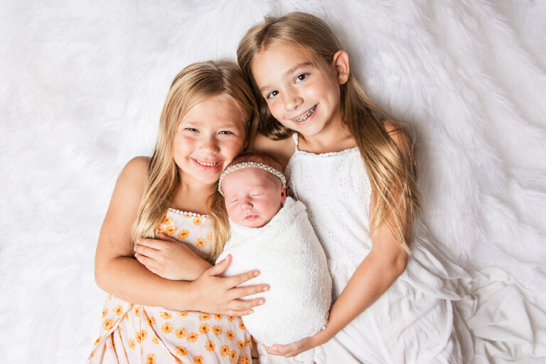 in home newborn plano photo session with sisters