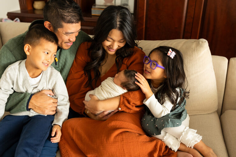 plano newborn photographer taking sweet family portraits in home