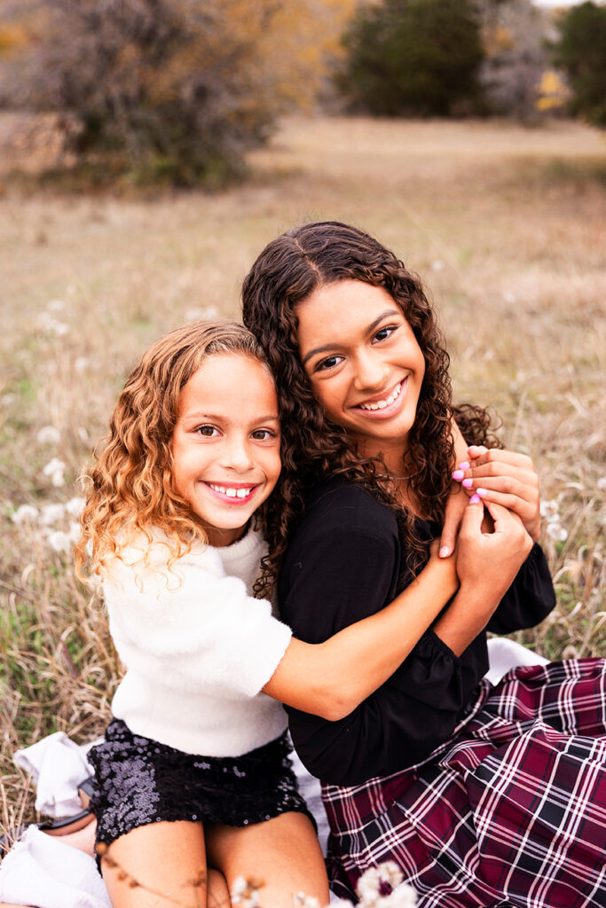dfw family photos taken in a field at arbor hills nature preserve in Plano