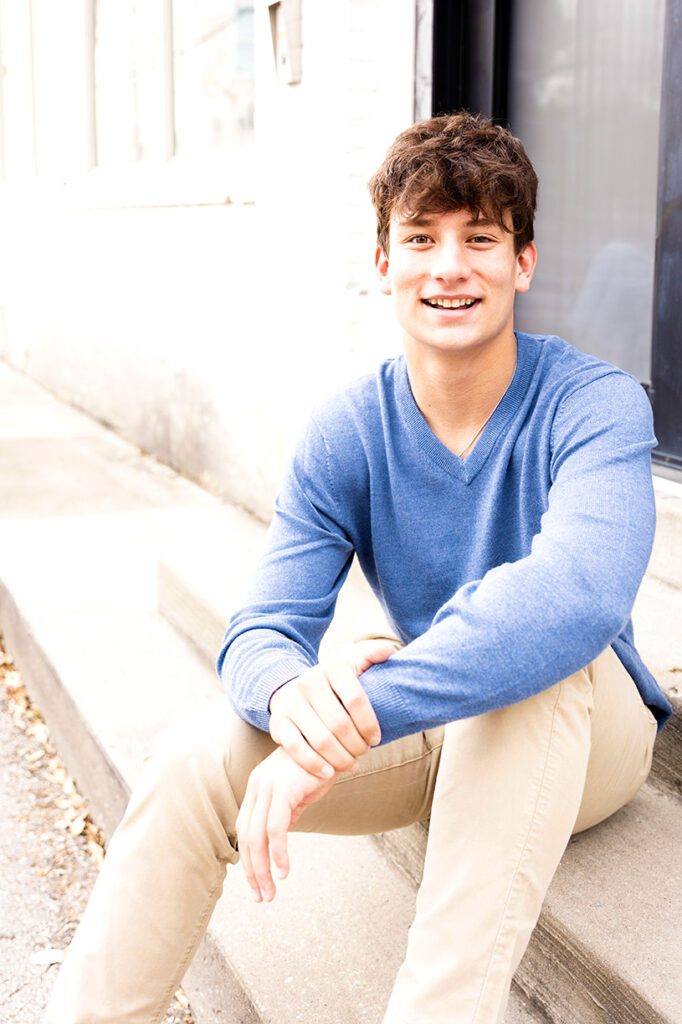 senior guy sitting on steps