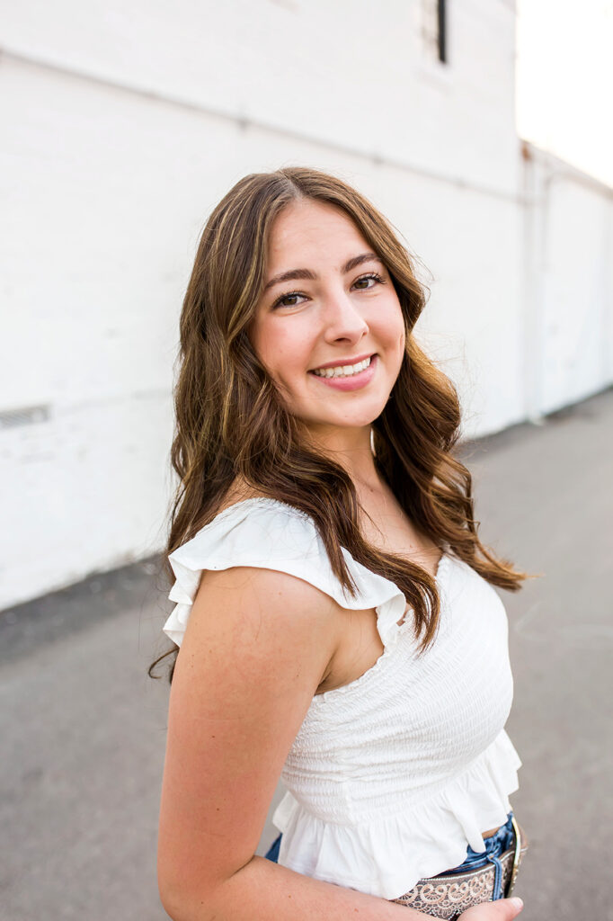 Confident senior posing for camera plano senior photographer