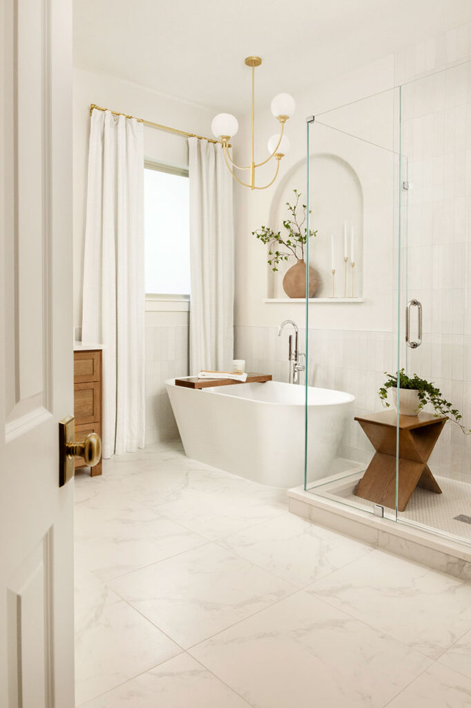 all white primary bathroom plano interior photographer peeking through door