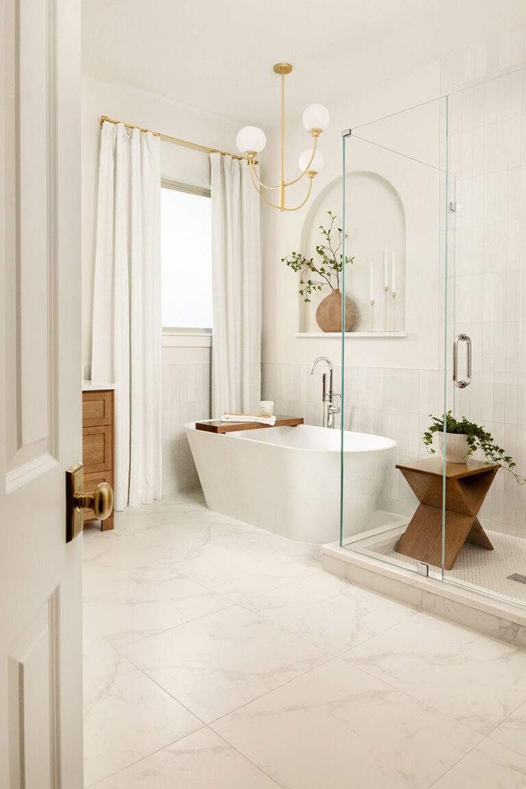 all white primary bathroom plano interior photographer peeking through door