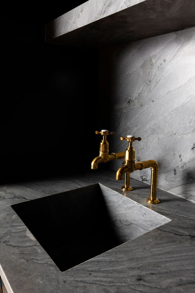 dallas interior detail shot of brass hardware in a square sink