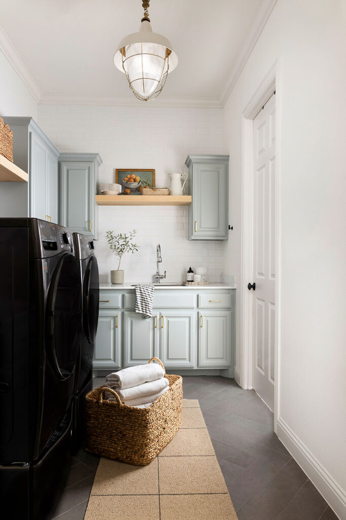 thoughtfully designed laundry room in Dallas with white walls