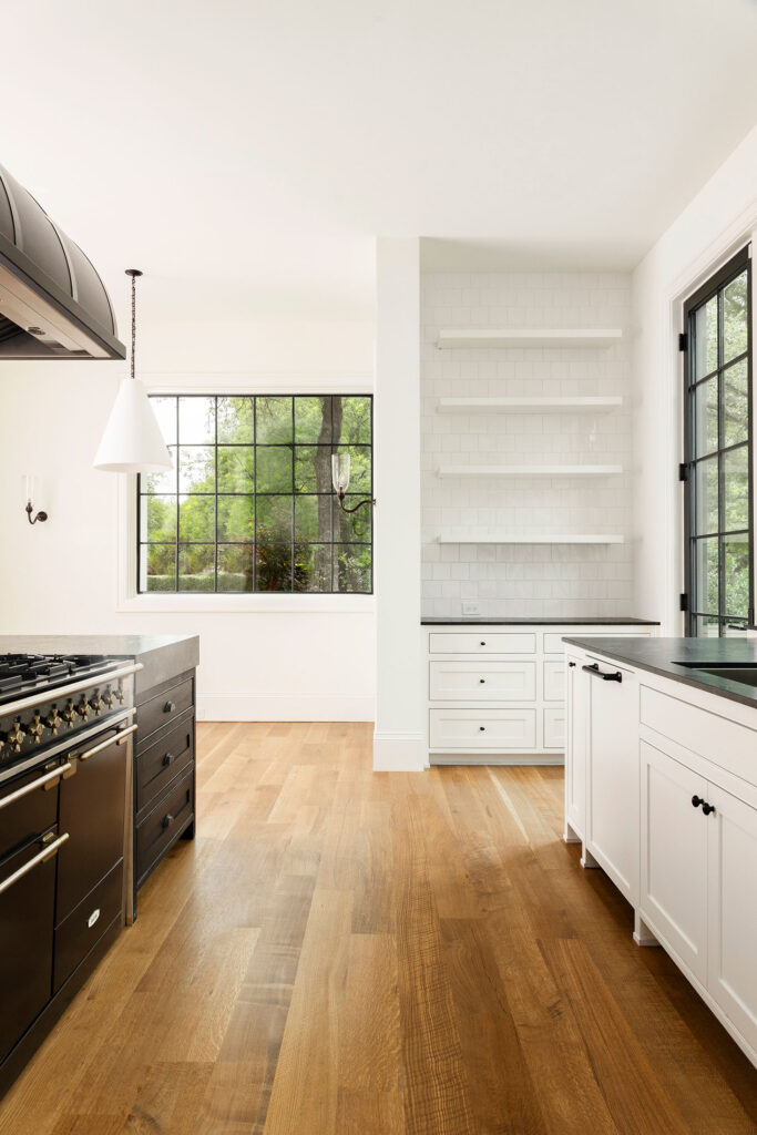 black and white kitchen with window views