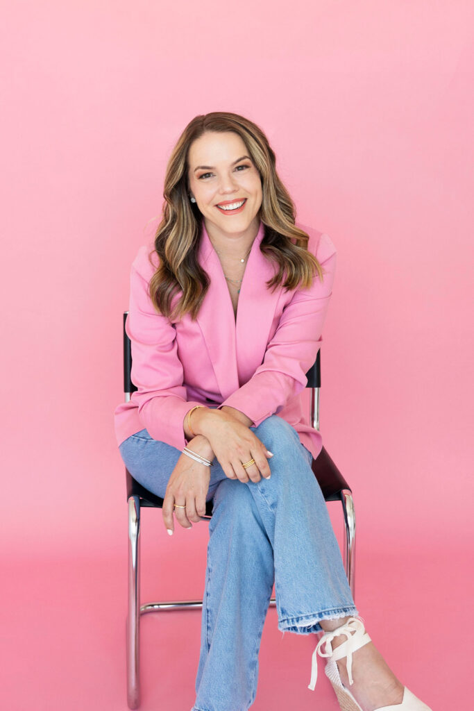 dallas branding photographer in studio with pink background