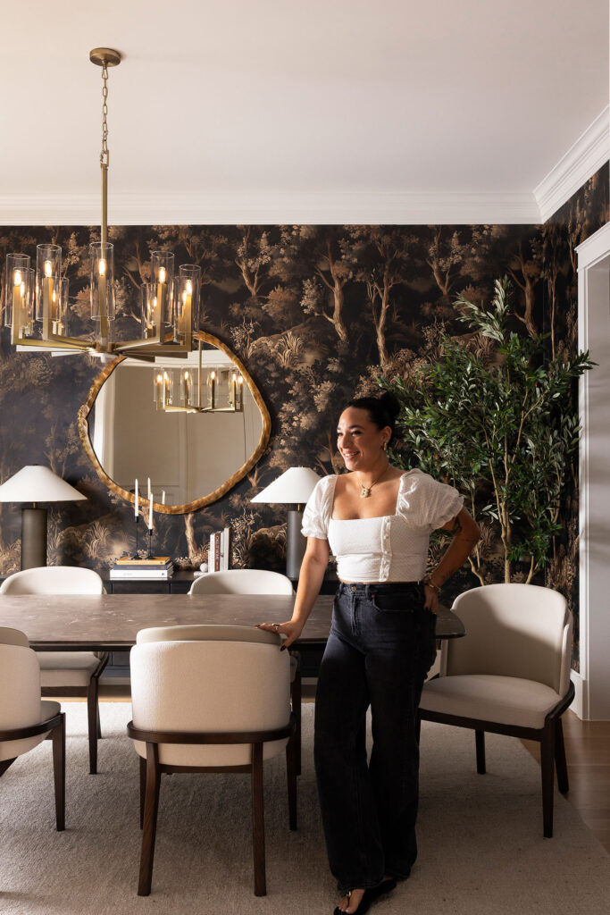 interior designer standing in front of a completed project