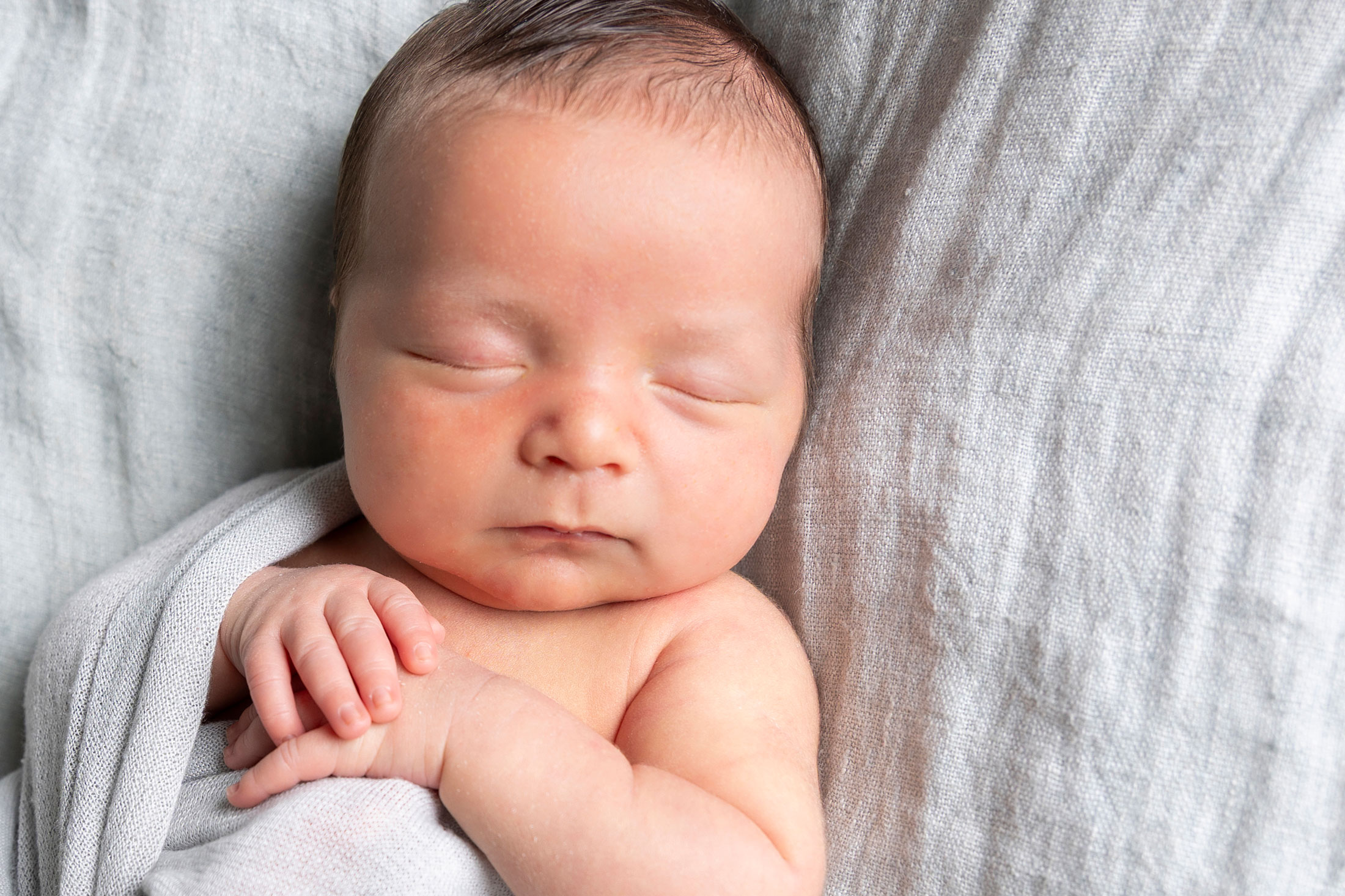 detail plano newborn photographer of sleeping baby
