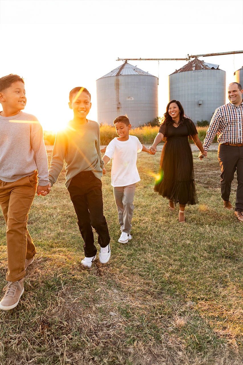 frisco family at sunset at a field in the fall