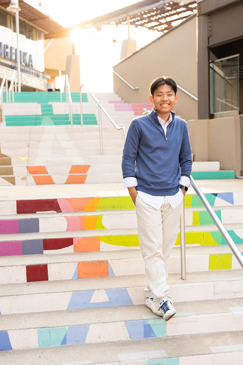 frisco senior photographer of a guy standing on stairs