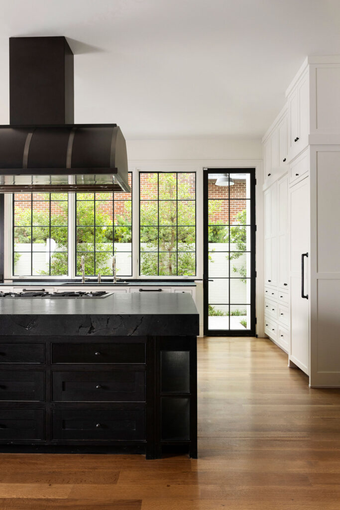 black and white kitchen with large windows