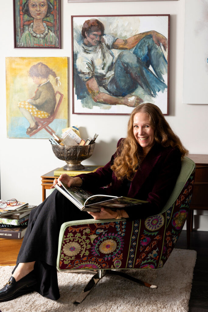 moody interior designer reading a book