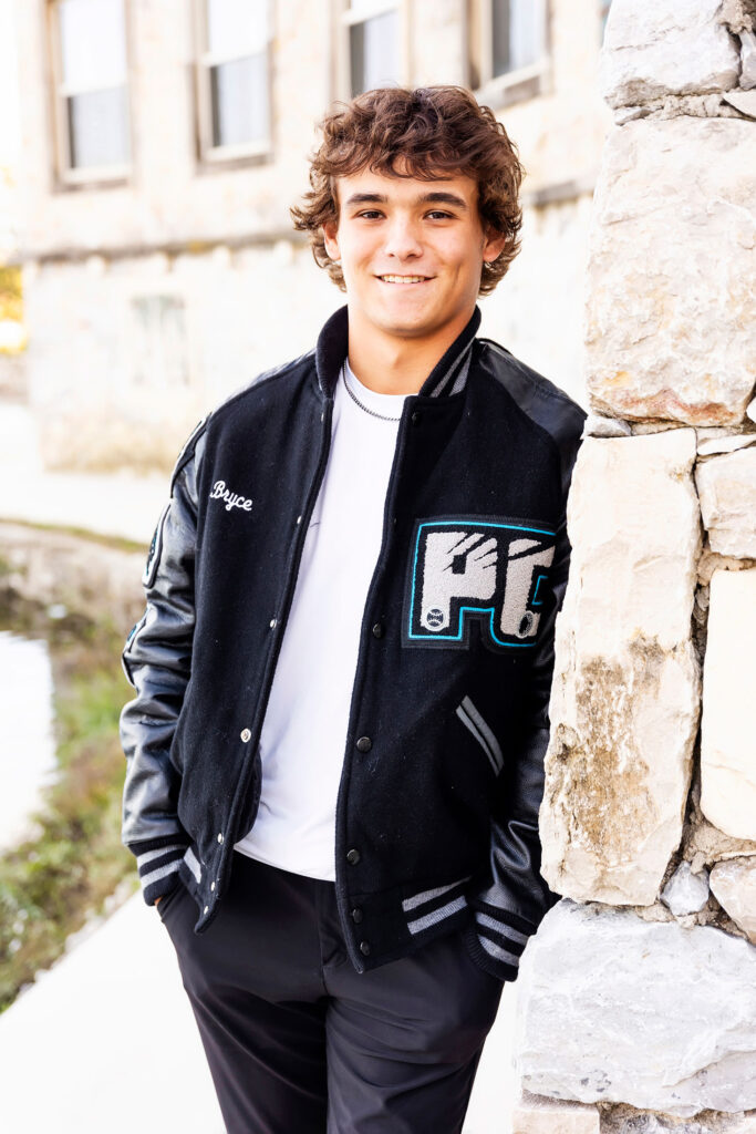 senior photos in a letterman jacket