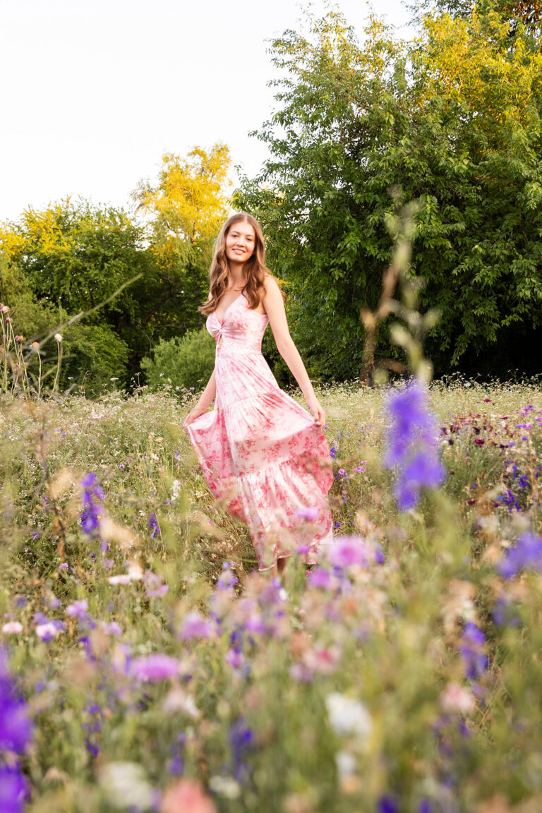 girl twirling a dress in a field of wildflowers in dallas