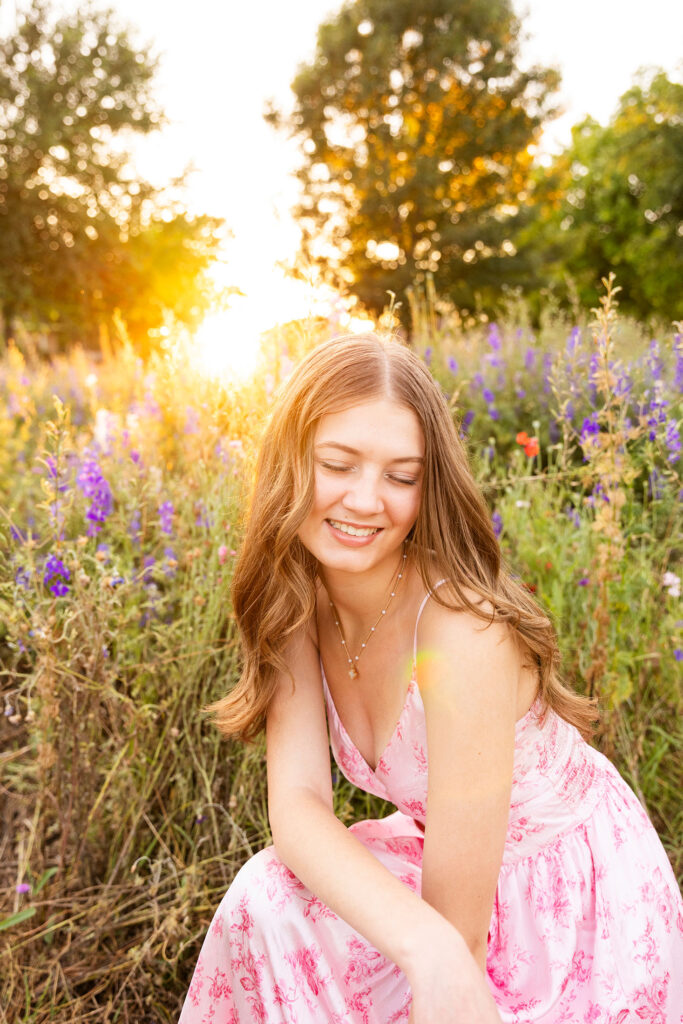 girl smiling in a field of wildflowers in texas
