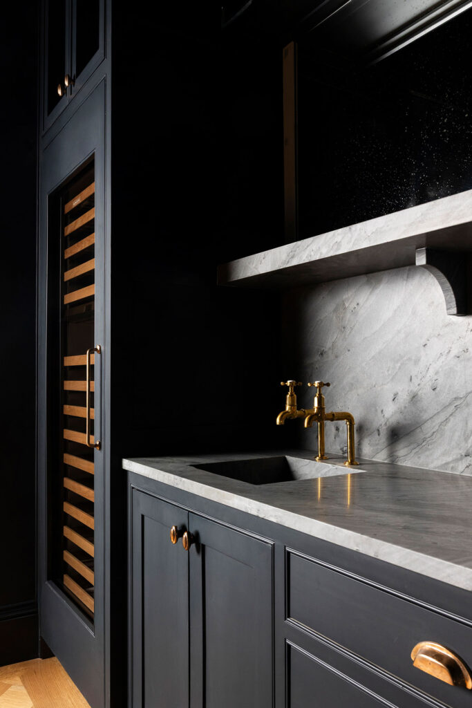 color drenched bar with chrome faucets