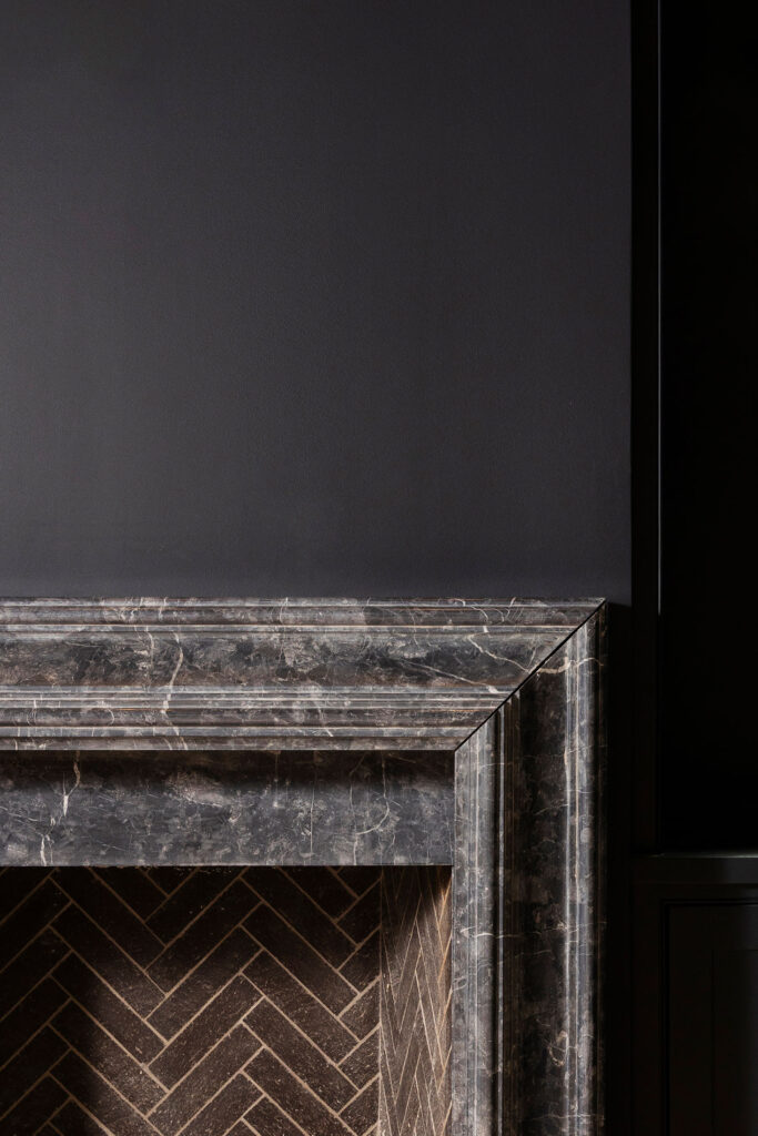 dark walls with custom fireplace