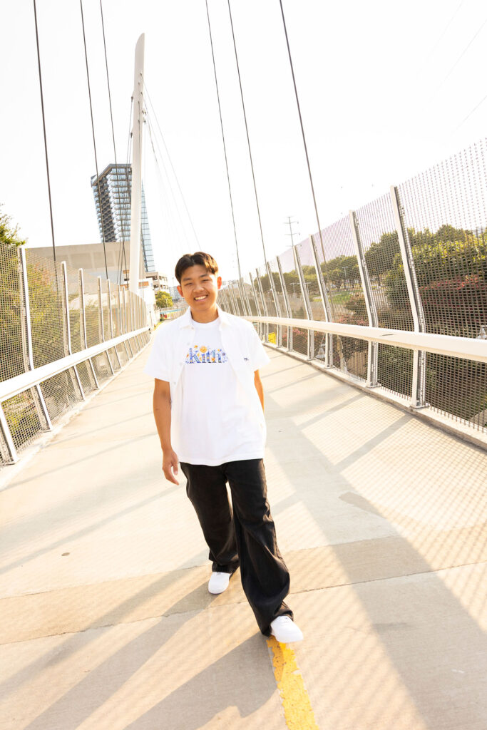senior photos in frisco on a bridge