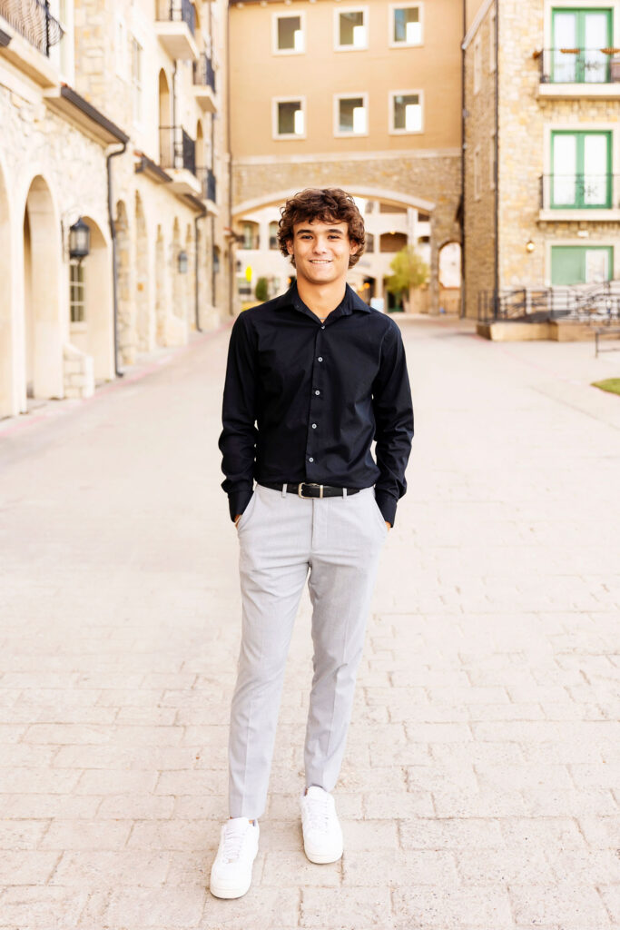 senior photos of a guy standing at the adriatica