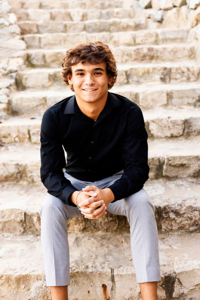 senior guy sitting on stairs