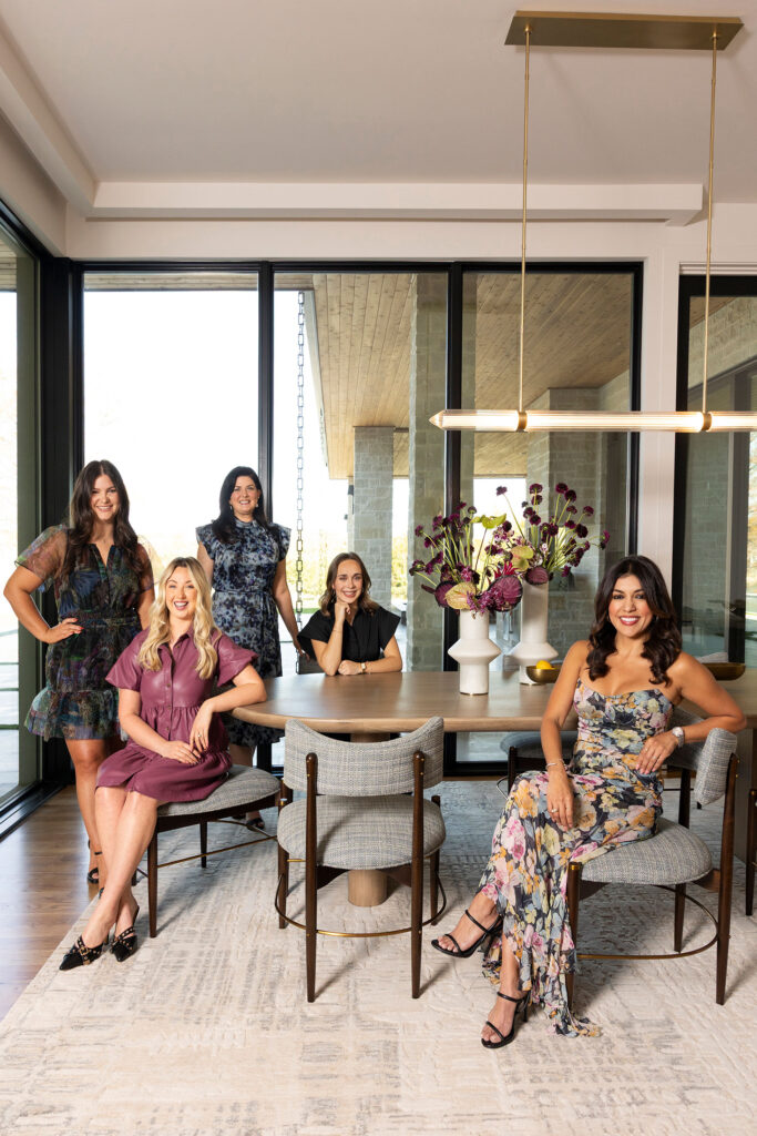 team photo dallas sitting in a dining room