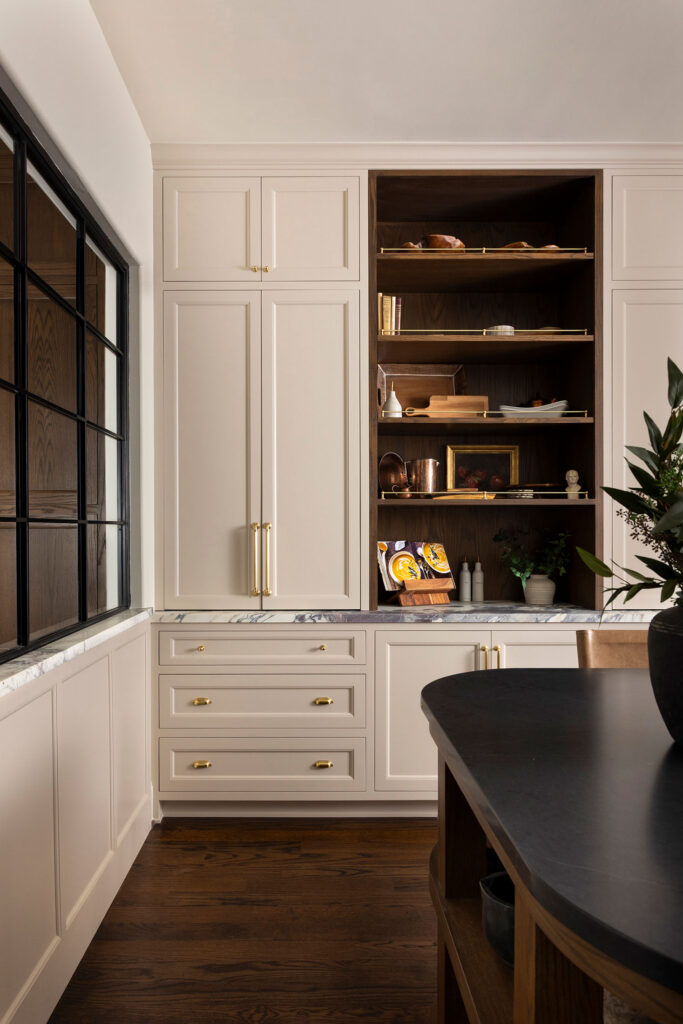 full shot of hidden cabinets with styled cabinets