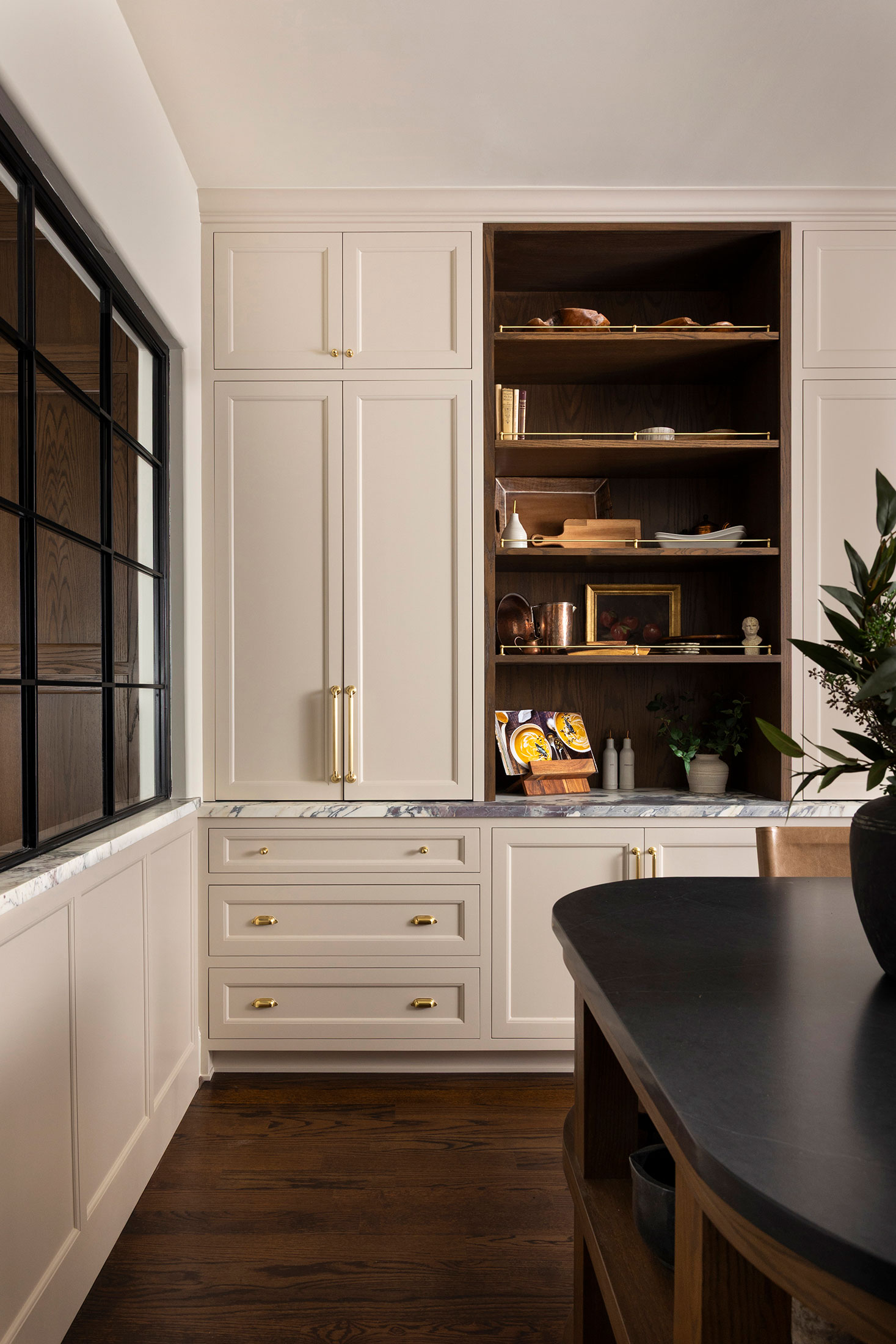 full shot of hidden cabinets with styled cabinets