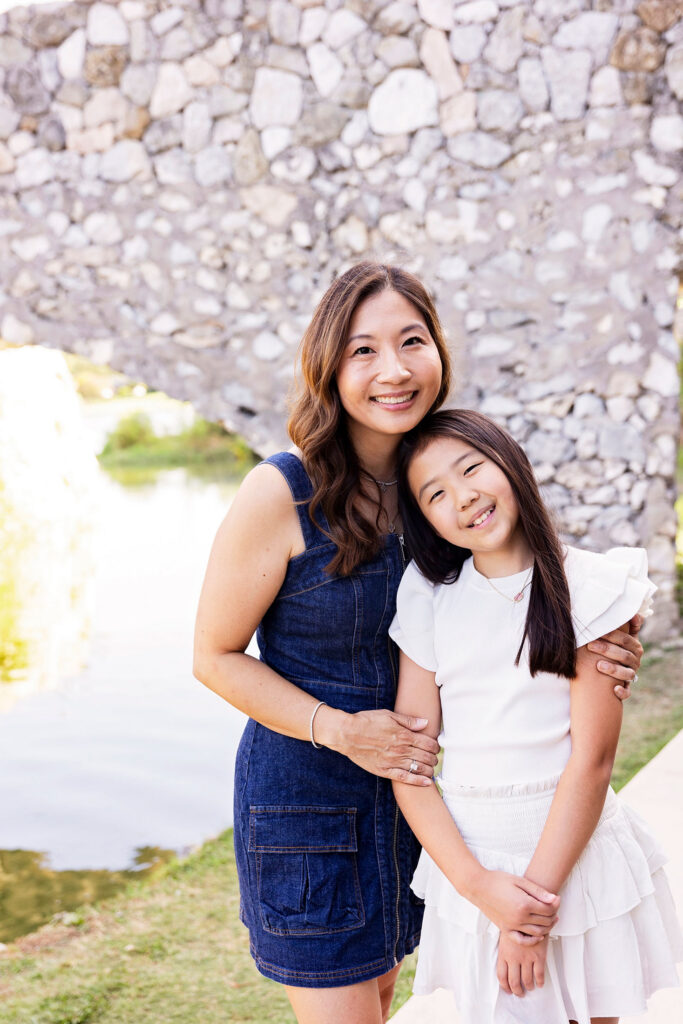 mom and daughter smiling
